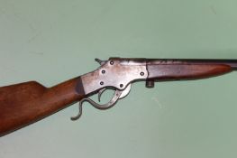 A Stevens .22 under lever single barrel rifle, serial number G546, together with a similar 9mm