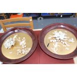 A pair of Japanese circular wall plaques, carved flowers with lacquer surrounds, 46cm diameter