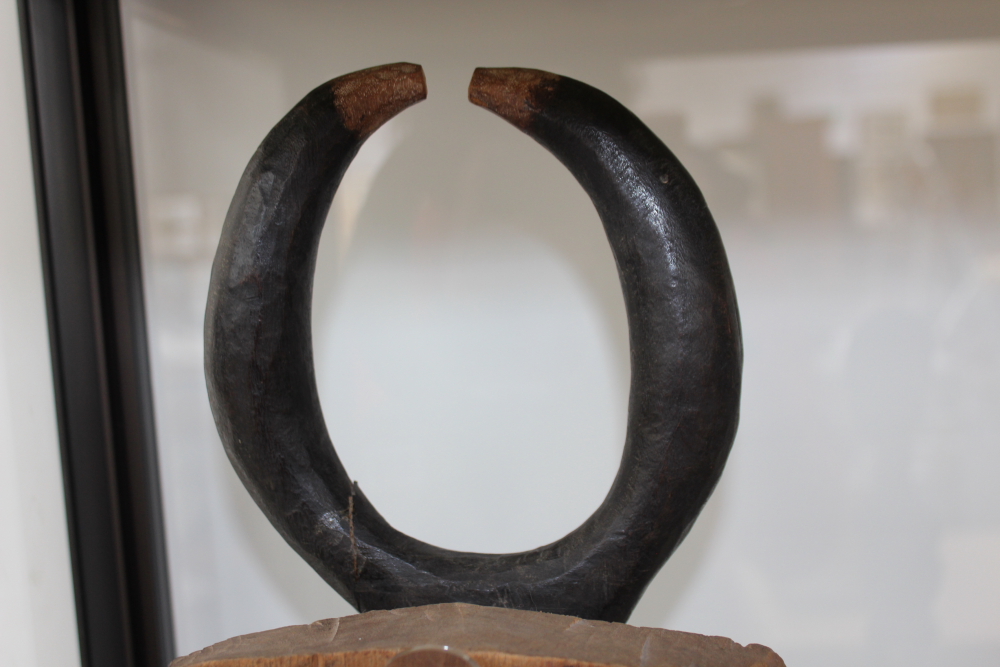 A carved and polychrome tribal ceremonial mask with horn crest, possibly African. - Image 6 of 13