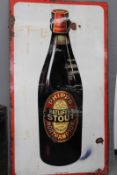 A rare large enamel advertising sign for Phipps Ratliffes Stout, with pictorial image of ale bottle,