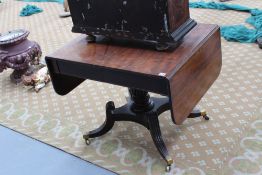 A carved mahogany Regency sofa table stamped Baines and Son, 1 St Pauls Churchyard, two apron