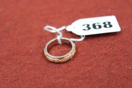 An 18ct bicoloured gold wedding ring, 8.3grms
