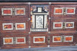 An early 18th Century Portuguese table cabinet, with ivory, tortoiseshell and boxwood decoration,