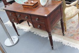 A Regency mahogany side table in the manner of Gillows, four short drawers flanking centre drawer,