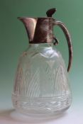 A silver mounted glass claret jug with etched and cut decoration, London 1905, 22cm high