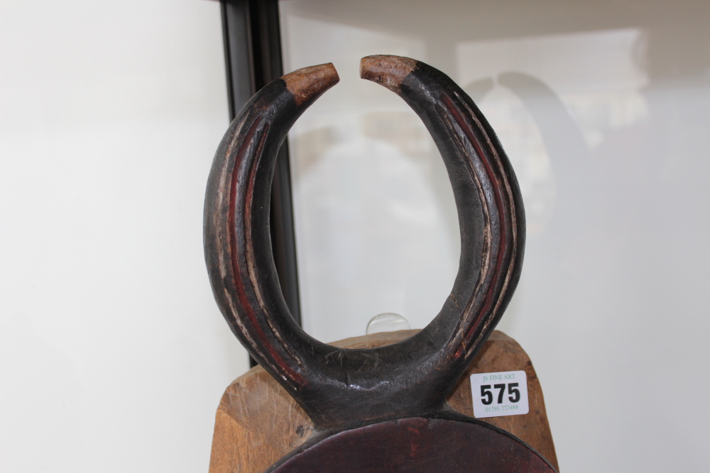 A carved and polychrome tribal ceremonial mask with horn crest, possibly African. - Image 3 of 13