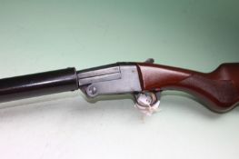 A Pedretti single barrel .410 shotgun with full length sound suppressor. 24 1/4 inch barrel,