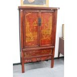 A Chinese gilt and rouge lacquer floor standing cabinet, with dragon and figural decoration, 186cm