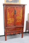 A Chinese gilt and rouge lacquer floor standing cabinet, with dragon and figural decoration, 186cm