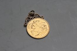 A gold half sovereign pendant dated 1899