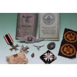 A group of German World War II badges, medals and related ephemera