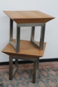 A pair of contemporary brushed steel and oak occasional tables, 65cm