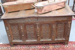 An early panelled oak coffer, with carved fielded panels and mouldings, 132cm wide x 59cm wide