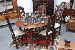 A group of five early carved oak and walnut highback solid seat chairs, with turned stretchered