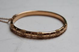 A 15ct gold coloured stiff bracelet, 11grms