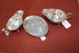 A pair of silver sauce boats, Birmingham 1935, Adie Brothers Ltd, 7ozs, and a George III silver oval