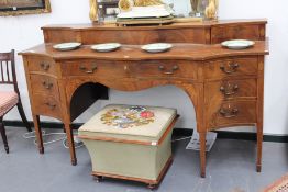 An antique George III style mahogany and inlaid serpentine front sideboard, 198cm wide