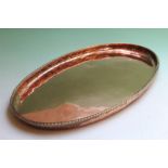 Hugh Wallis: an oval copper tray with rope-twist border, 43 x 23cm