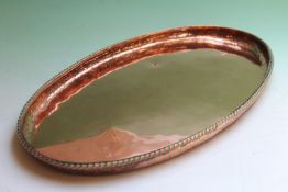 Hugh Wallis: an oval copper tray with rope-twist border, 43 x 23cm