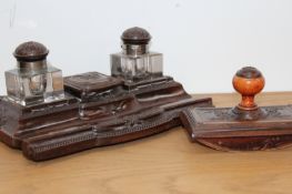 A 19th/20th Century gutta percha and brass inlaid desk stand, with two inkwells and matching