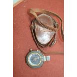 A World War I military marching compass, in leather case