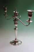 A silver two branch table candelabra, with tapered stem, octafoil base, dated Birmingham 1959,