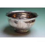 A Chinese silver coloured bowl decorated with panels depicting figures in landscape, 19cm diameter x