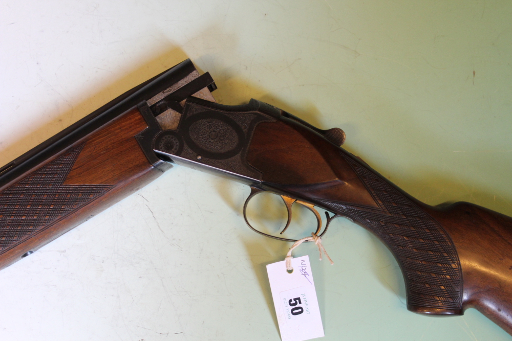 A Laurona 12-bore over and under shotgun, 26inch barrels, border and scroll engraved double - Image 2 of 11