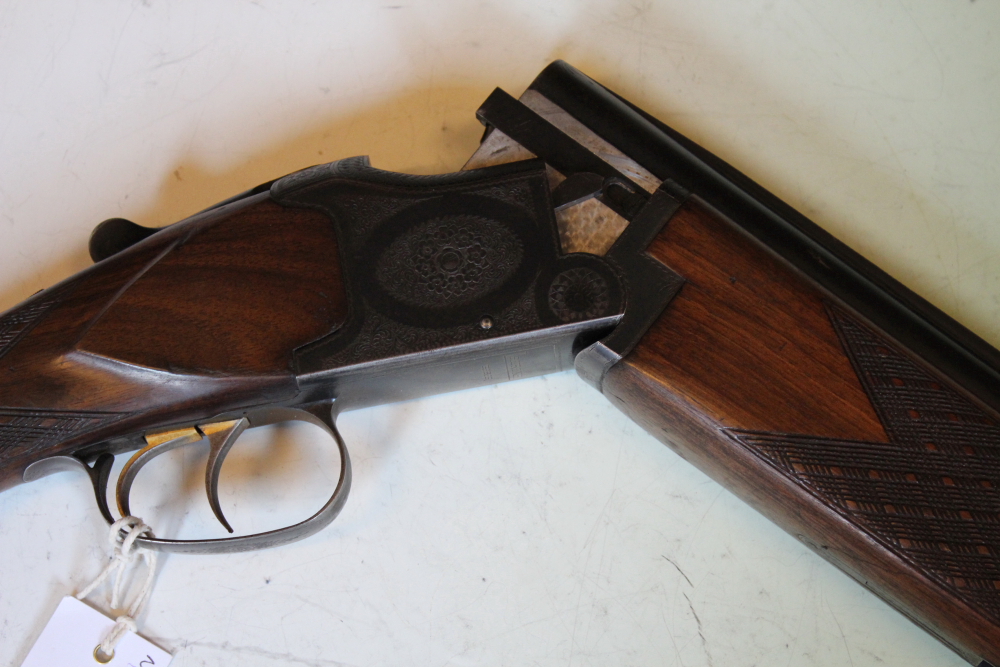 A Laurona 12-bore over and under shotgun, 26inch barrels, border and scroll engraved double - Image 9 of 11