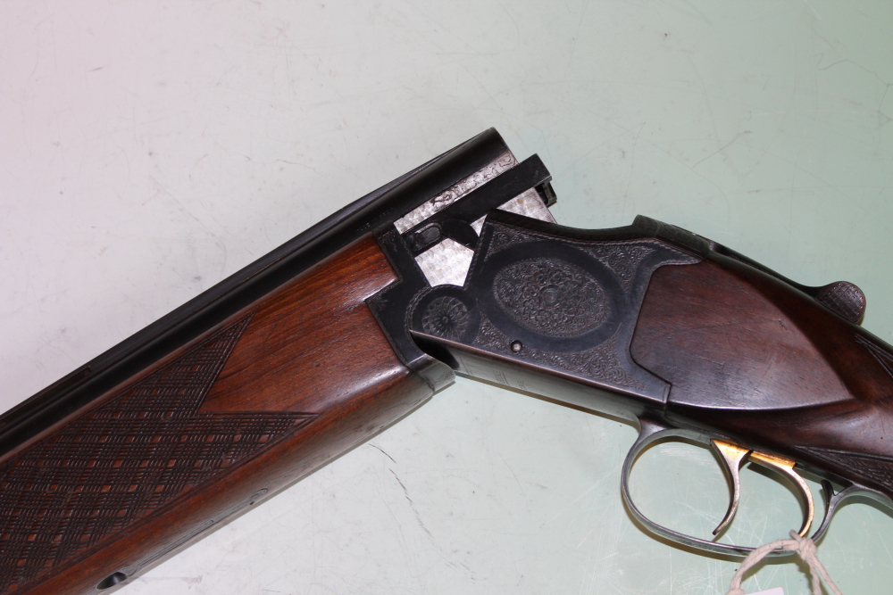 A Laurona 12-bore over and under shotgun, 26inch barrels, border and scroll engraved double - Image 5 of 11