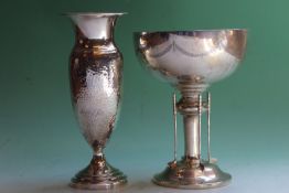 A silver golfing trophy with turned stem and chased garland decoration, Birmingham 1930, 7ozs,