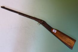 A BSA underlever tap loading air rifle, serial no. S21159 together with an early tinplate Diana