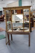 A 19th/20th Century giltwood vitrine cabinet, with adjustable shelving within, supported on oak