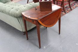 A mahogany inlaid late Georgian pembroke table, with crossbanded top apron drawer, on straight