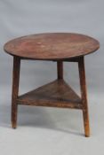 An 18th/19th Century oak cricket table, with platform undertier, 69cm diameter