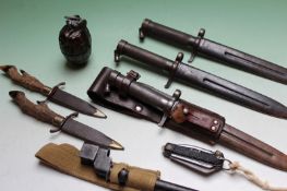 Two steel scabbard military bayonets, an Enfield stick bayonet, pocket knives and a dummy grenade