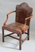 A Georgian mahogany desk armchair, with leather upholstered back panel and drop in seat