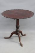 A George III mahogany tilt top table, with piecrust edge, on turned column and shaped leg, 80cm