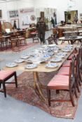 A bespoke Regency style mahogany pedestal dining table, with fluted edge top and two extension