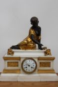 A large 19th Century French gilt and patinated bronze and white marble figural mantel clock, the