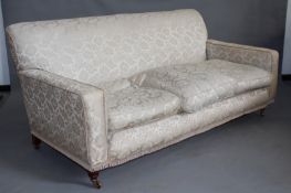 A large Edwardian Howard style deep seat settee, 180cm wide