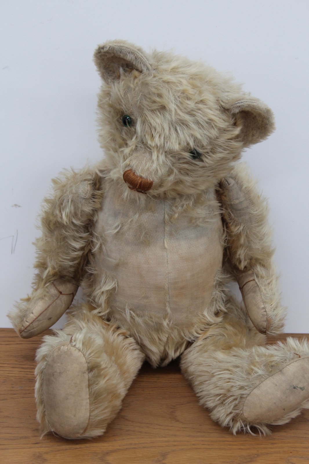 A large early 20th Century plush teddy bear.