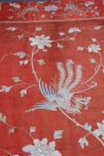 Two antique Oriental embroidered panels, one of dragons amidst clouds, and a silk panel of exotic