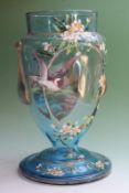 A late 19th Century blue tinted glass vase, decorated with hand painted enamel scenes of wild