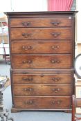 A Georgian carved mahogany chest on chest, the moulded cornice above four graduated long drawers,