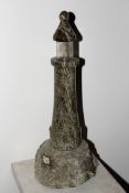 A Cornish polished and rough cut serpentine lamp in the form of a lighthouse. 41cm.