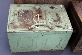 An antique iron strong box. With panel form top and sides and key.