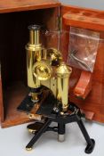 A J Swift 7 sons London laquered and gilt brass microscope in original case.