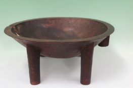 Two Polynesian carved wood tribal artifacts. A shallow footed “kava” dish. 49cm diameter and a