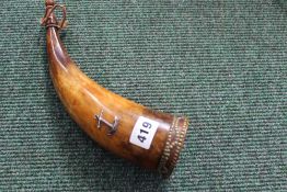 A 19th century horn powder flask with silver anchor applique and brass stud decoration